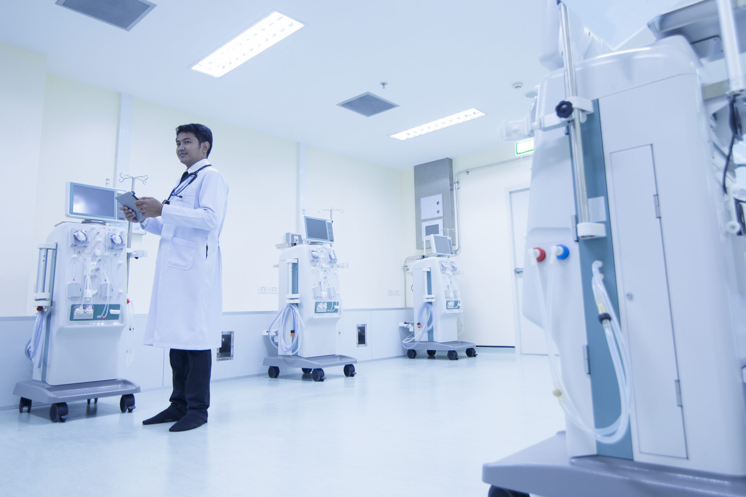 Doctor with modern equipment in the hospital,doctor using digital tablet against equipment,Equipment Dialysis machines in hospitals,Dialysis machines in  hospital  
Healthcare and medical concept.