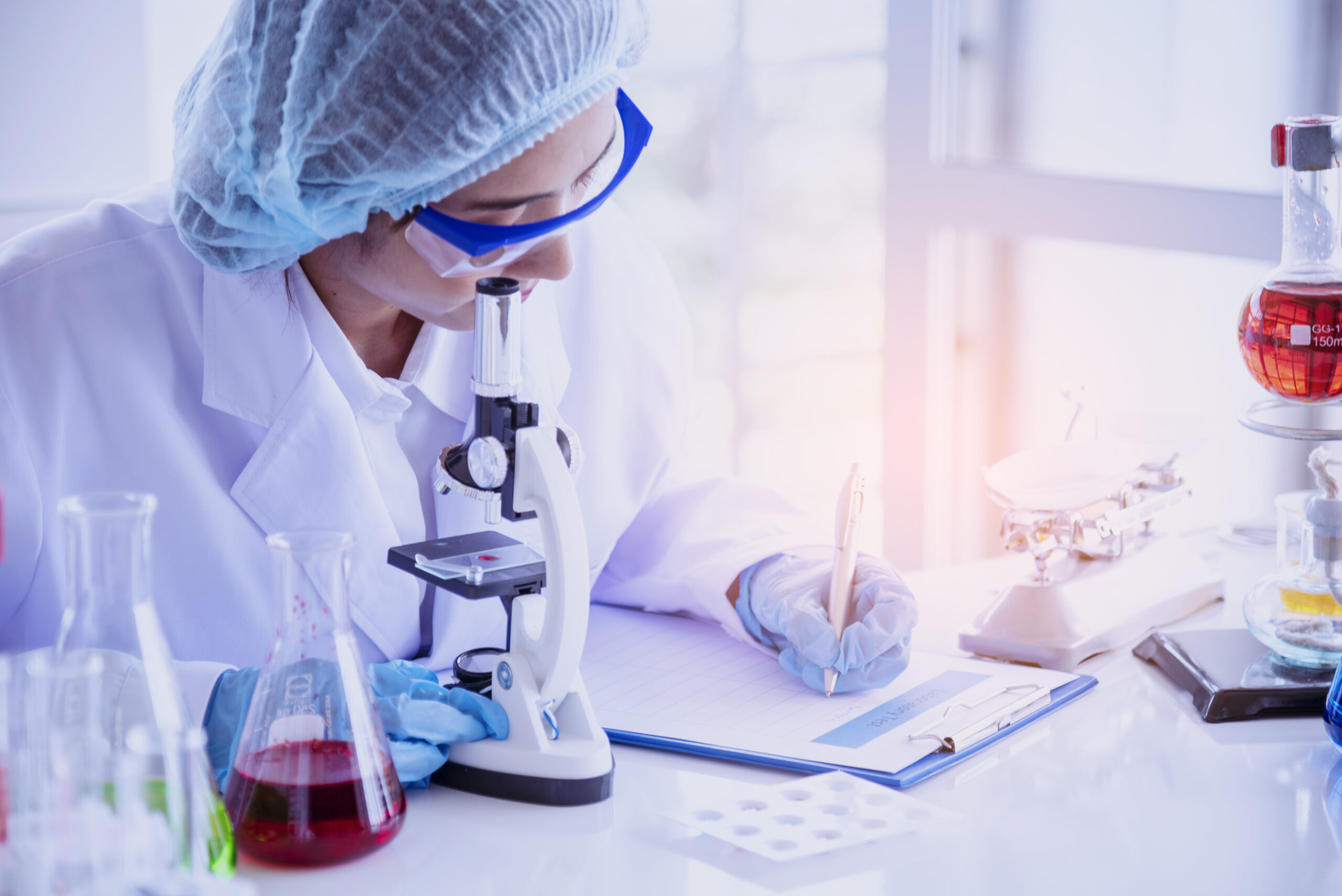 Female scientist look at microscope, science test tube analyse scientific sample in laboratory research experiment biotech make cultivate vaccine against virus. Chemistry science laboratory concept